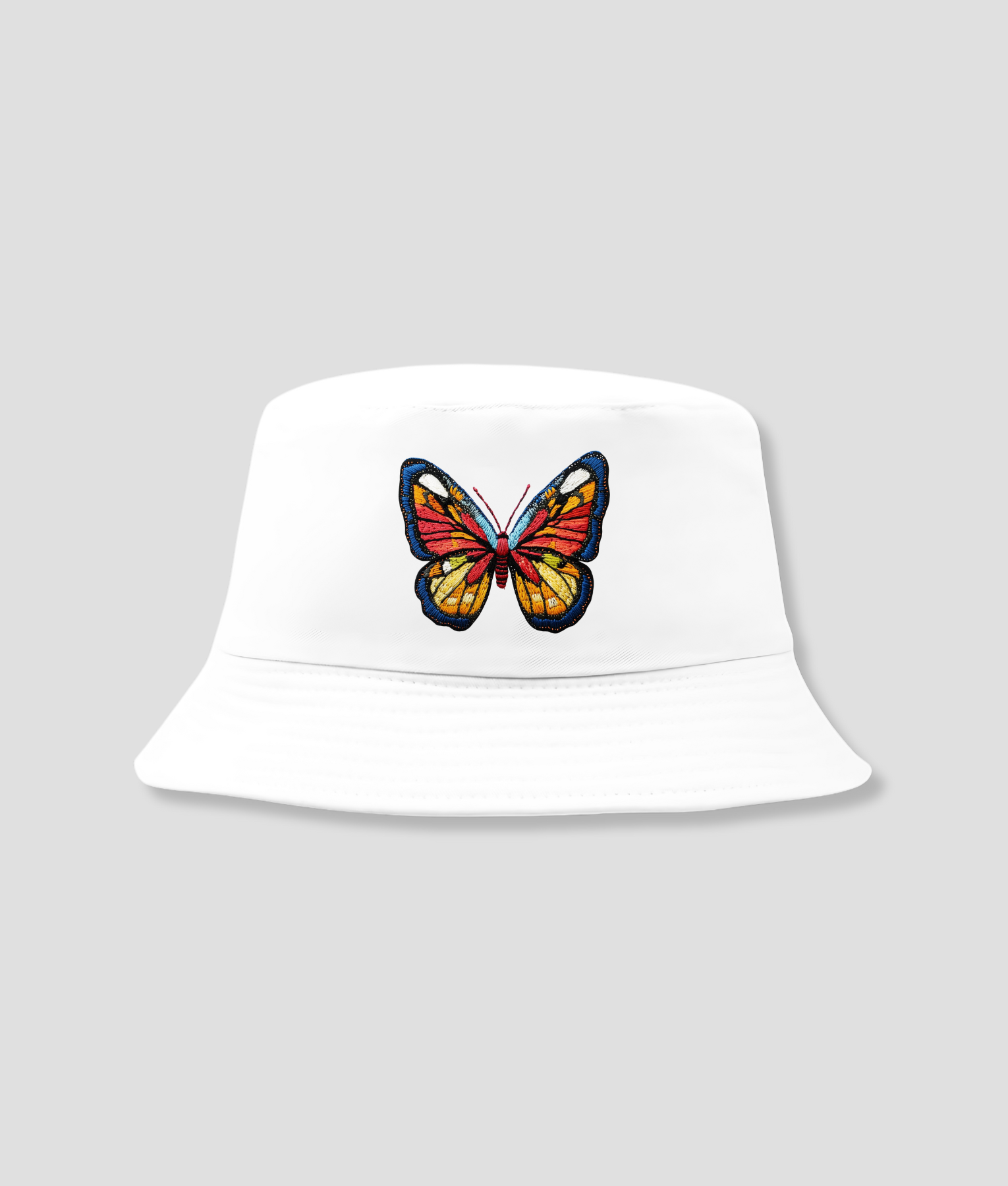 Hütchen mit farbigem Schmetterling Hütchen mit farbigem Schmetterling