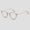 Gouden transparante cat-eye bril met champagnekleurig doorzichtig acetaat montuur goudkleurig metalen frame en heldere glazen